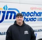 worker in front of van