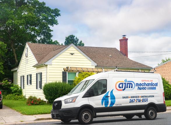 van in front of customer's house