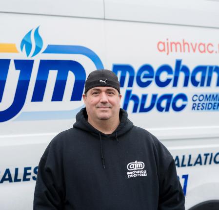 worker in front of van